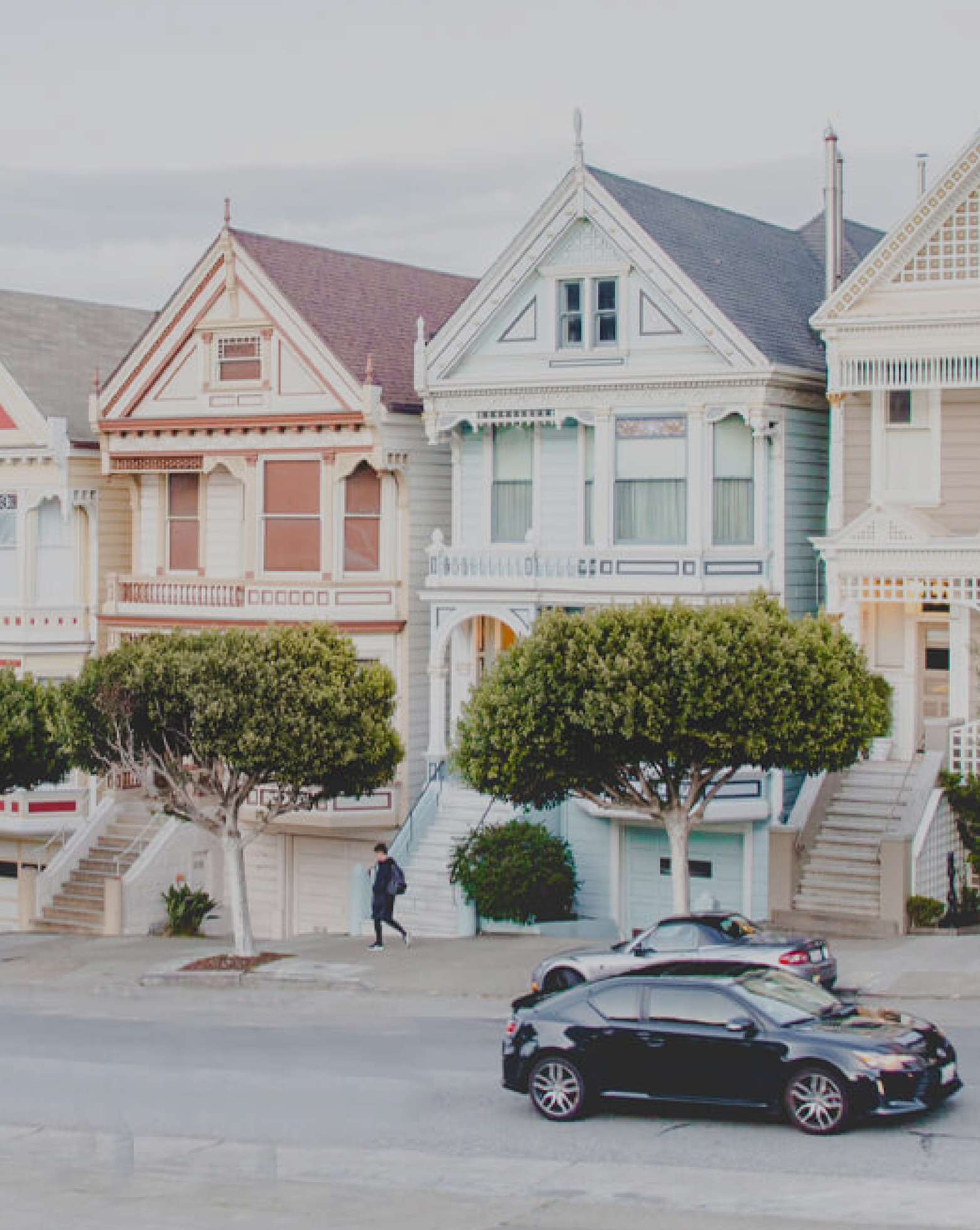 A row of houses in pastel colors