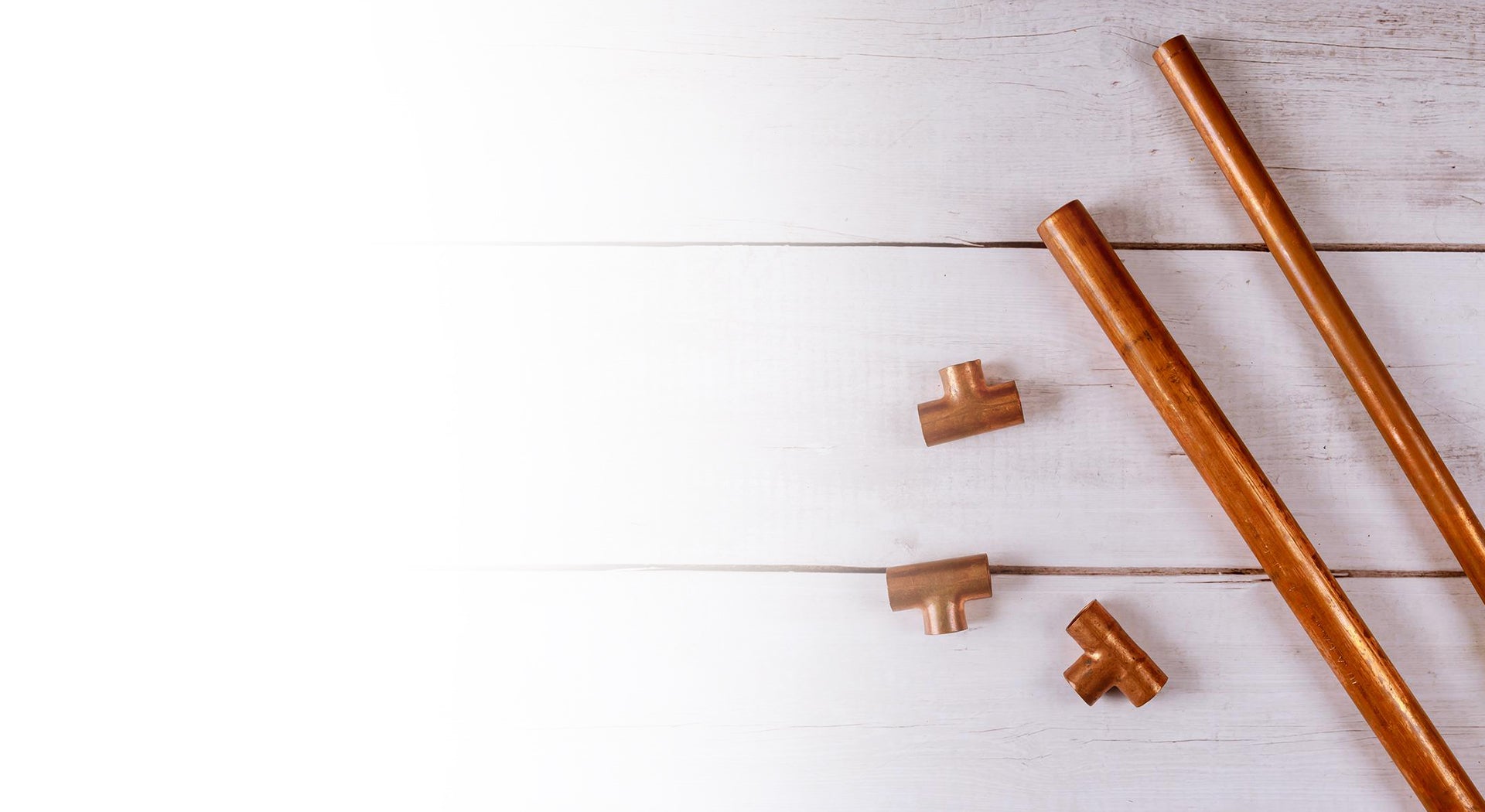 Copper pipes on the floor.