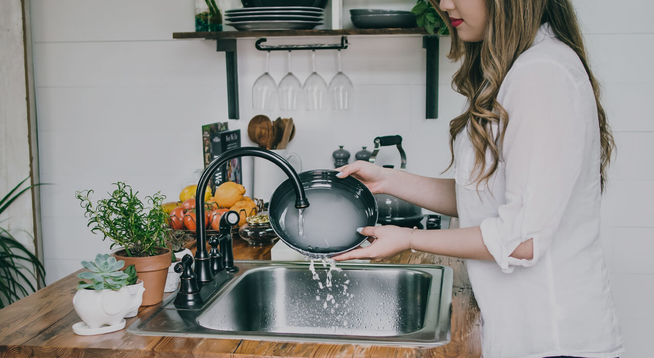 A woman washing the dishes